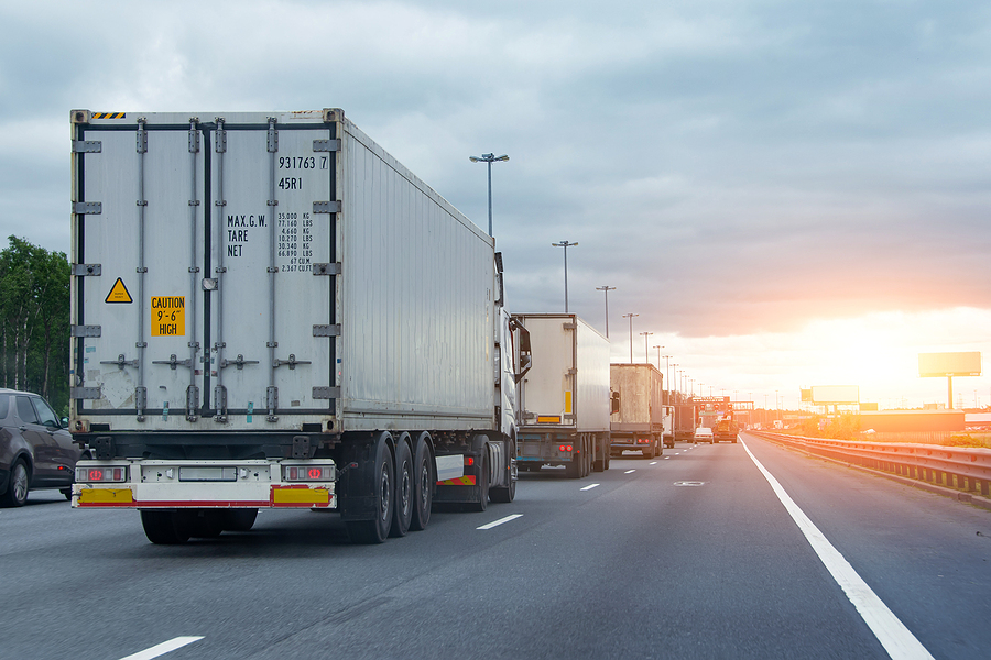 Home lorry trucks cars in traffic jam at border zone custom, sunset t
